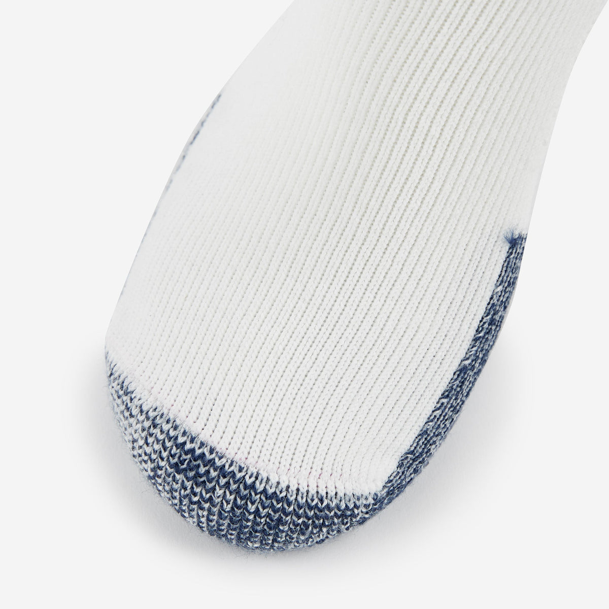 Thorlo thick cushion running rolltop sock in white with navy blue toe seam