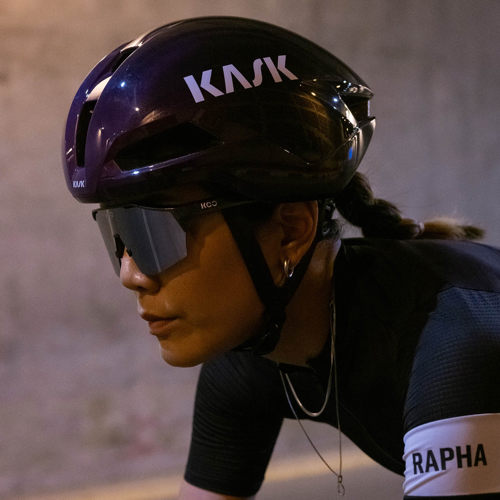 KASK Nirvana helmet in ultraviolet color worn by cyclist in aerodynamic position