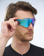 KOO Nebula sunglasses in teal matte frame with dark turquoise mirror lenses worn by model