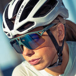 KOO HYPE cycling sunglasses in forest green matt with green mirror lenses on female cyclist