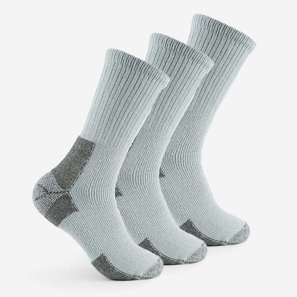 Three Thorlos Outdoor Explore MW Crew socks in light grey with dark grey heel and toe