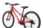 Close-up rear three-quarter view of Cannondale Kids Quick C2 in metallic red showing drivetrain and saddle