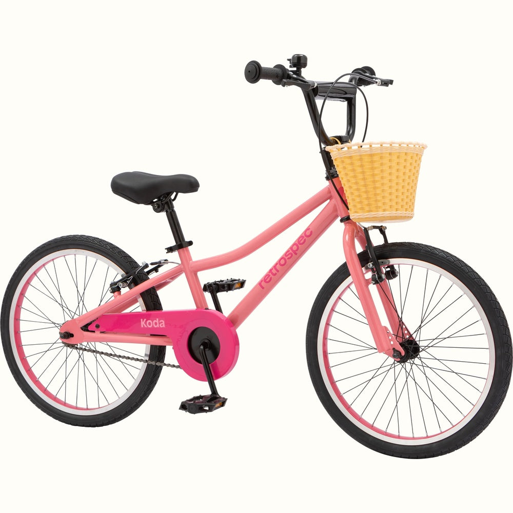 Retrospec Koda 20-inch kids bike in cotton candy pink with front wicker basket
