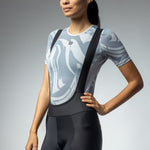 Woman wearing black ALE PRR Strada cycling bibshorts with suspenders