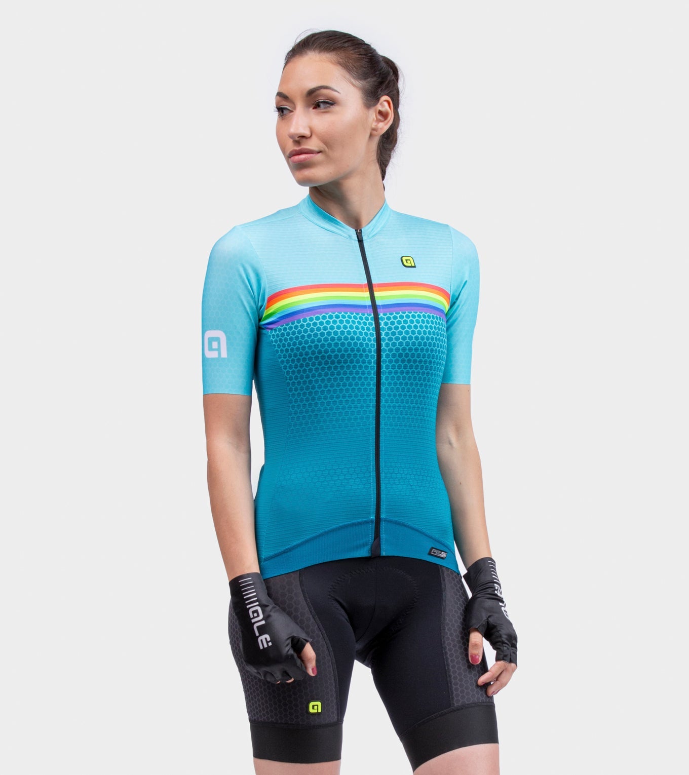 Woman wearing ALE cycling jersey in light blue with rainbow stripes