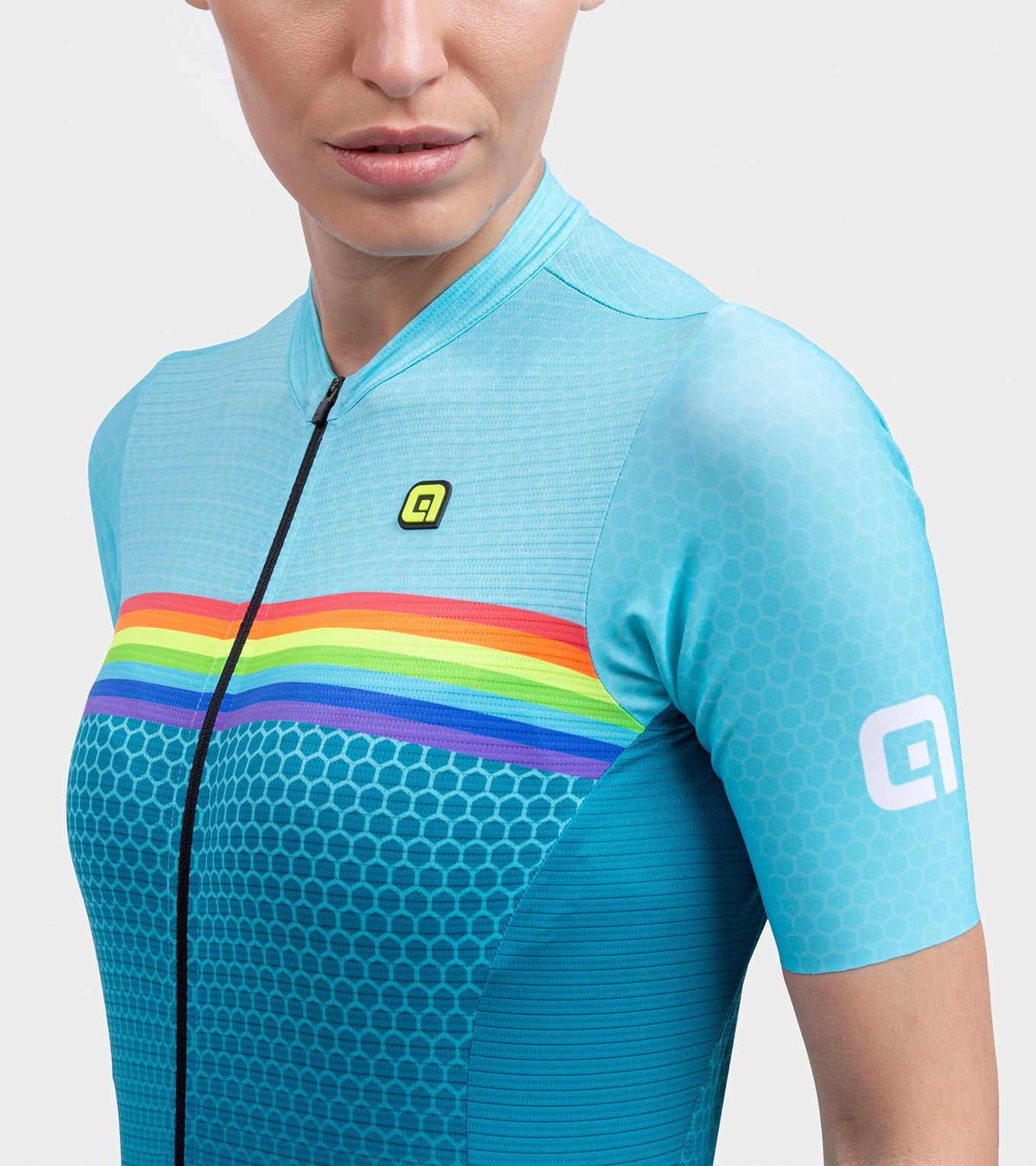 Women's light blue cycling jersey with rainbow stripes and geometric pattern
