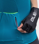 Woman wearing teal ALE cycling jersey with black gloves in professional studio shot
