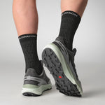 Salomon Thundercross trail running shoes in asphalt gray with person wearing dark socks