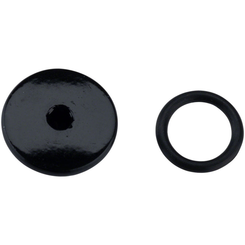 Black Shimano bleed screw and o-ring components on white background
