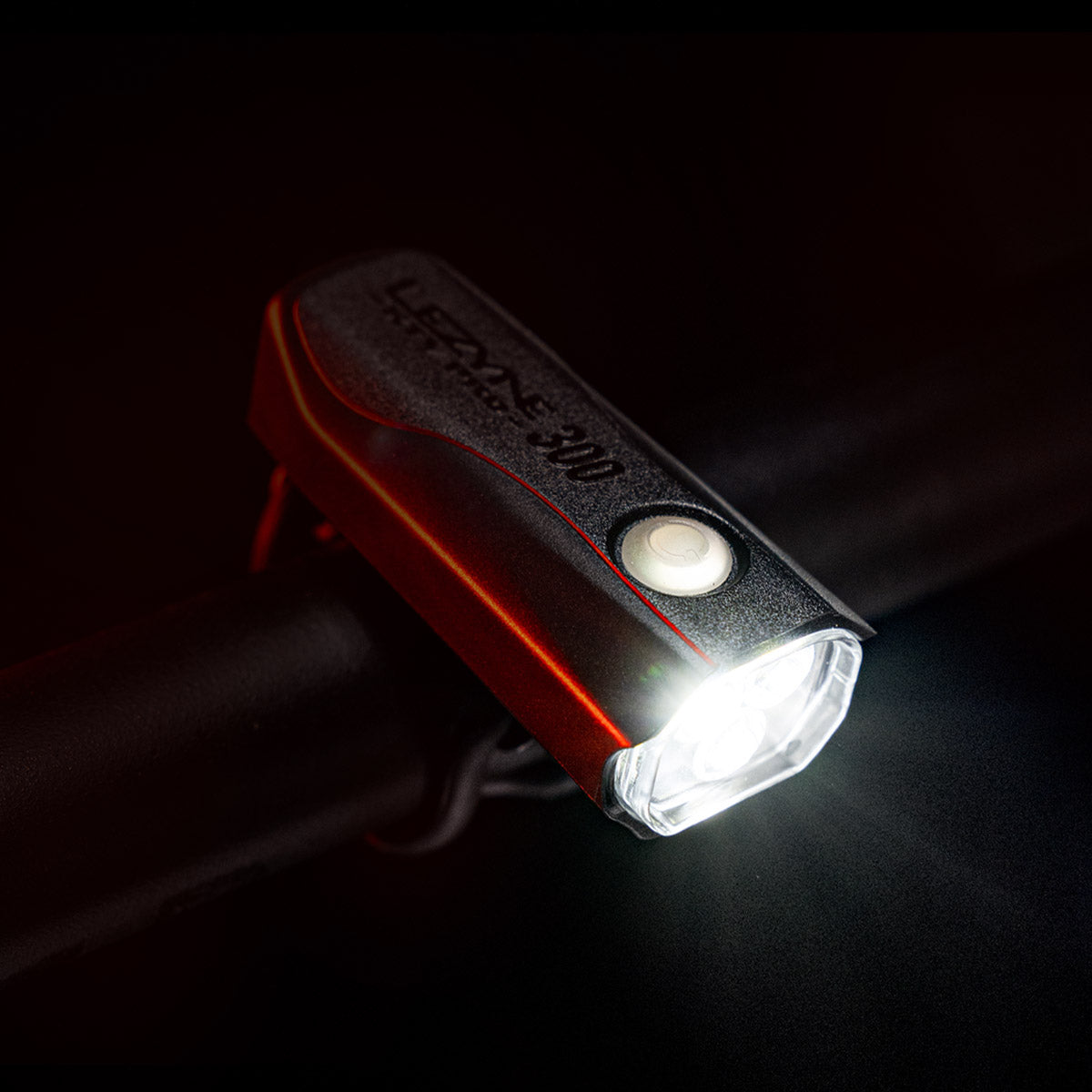 Lezyne KTV Drive Pro 300+ front bike light with LED illuminated on dark background