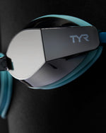 TYR Black Ops 140 EV racing goggles with mirrored smoke lenses and teal frame