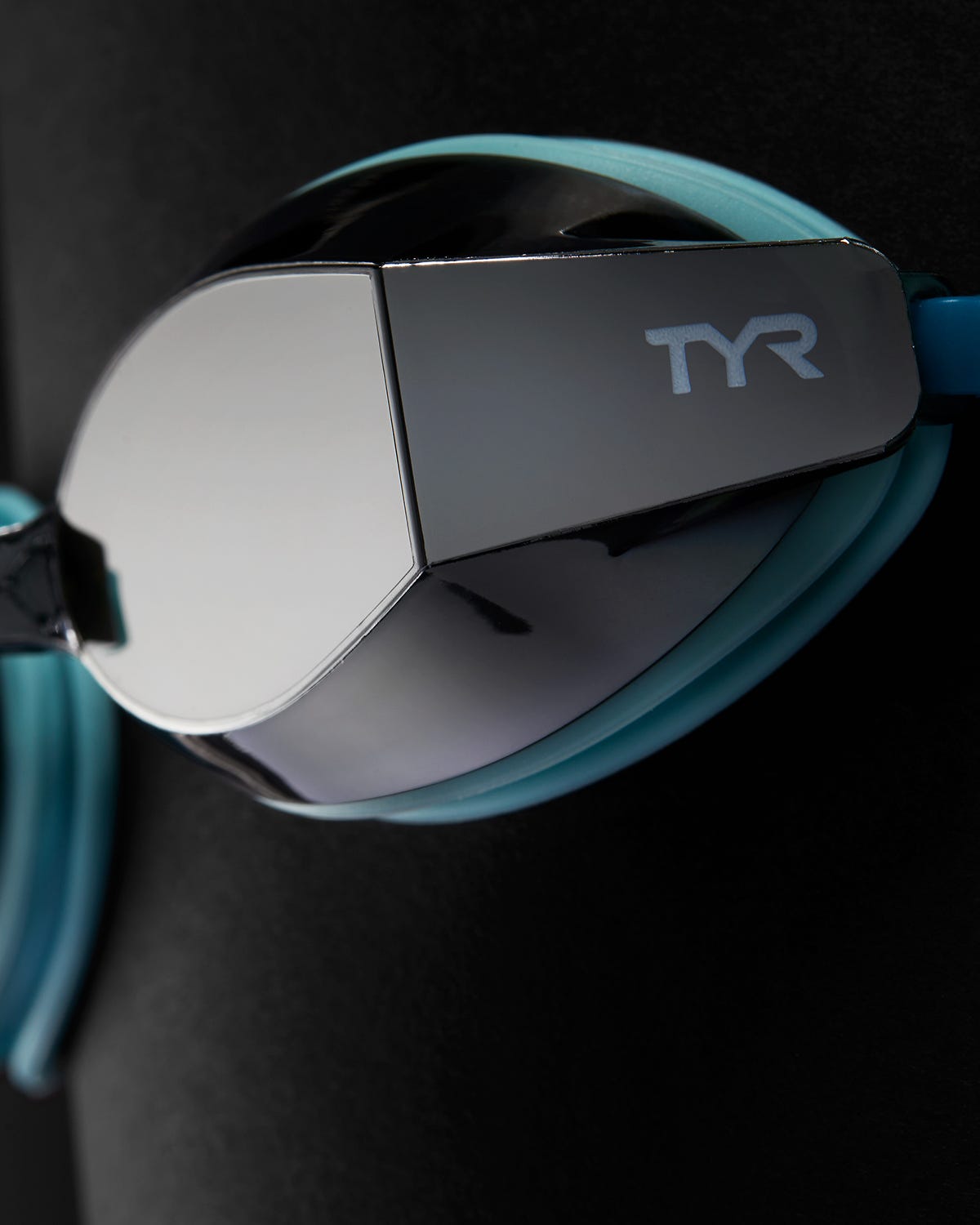 TYR Black Ops 140 EV racing goggles with mirrored smoke lenses and teal frame