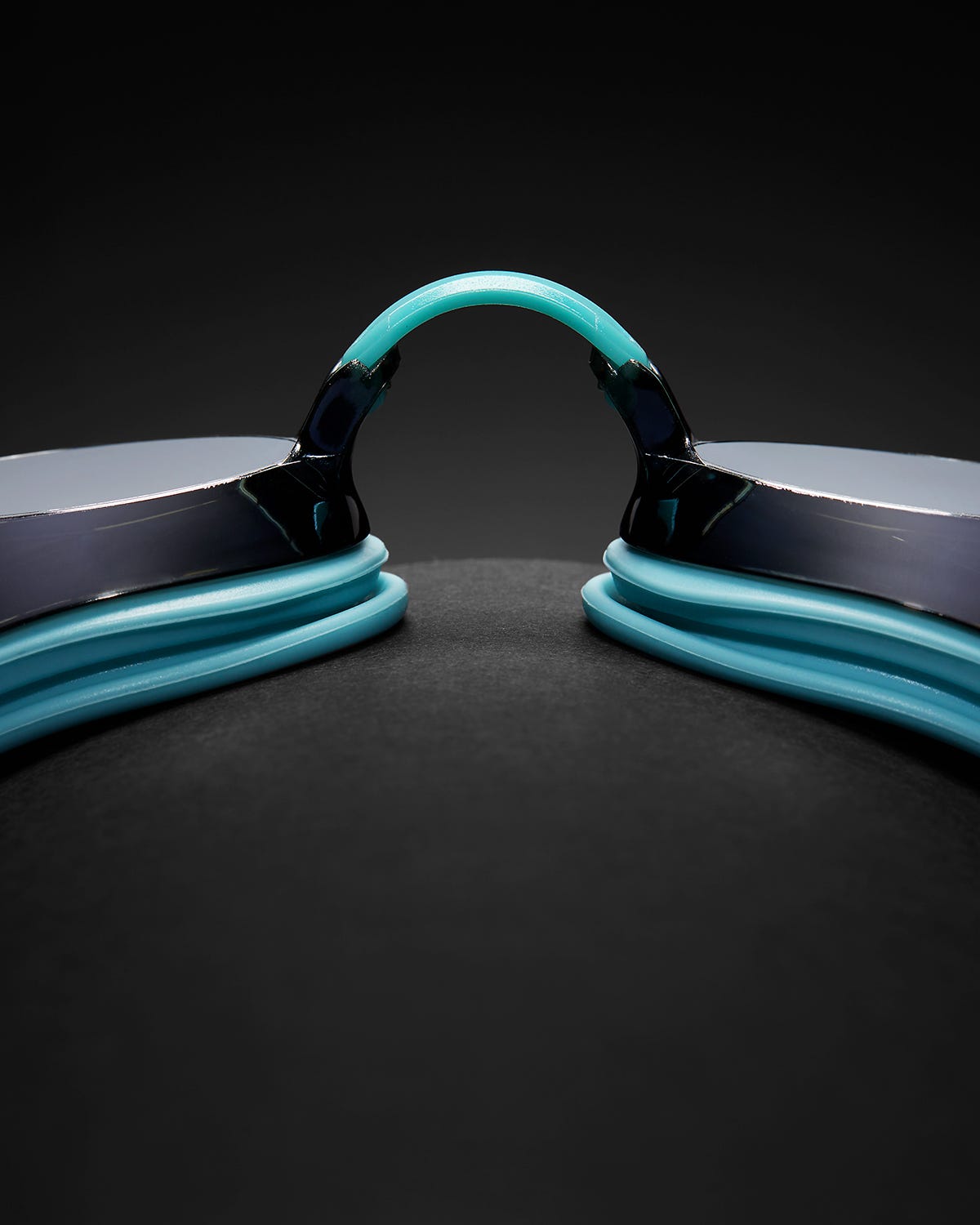 TYR Black Ops racing goggles with mirrored smoke lenses and teal accents