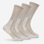 Three pairs of light brown Thorlos crew running socks with cushioned design