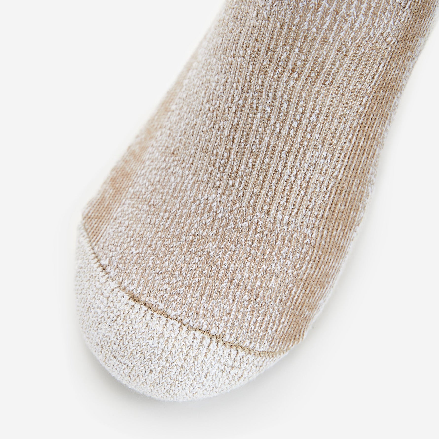 Close-up of khaki colored crew sock showing knit texture and reinforced heel