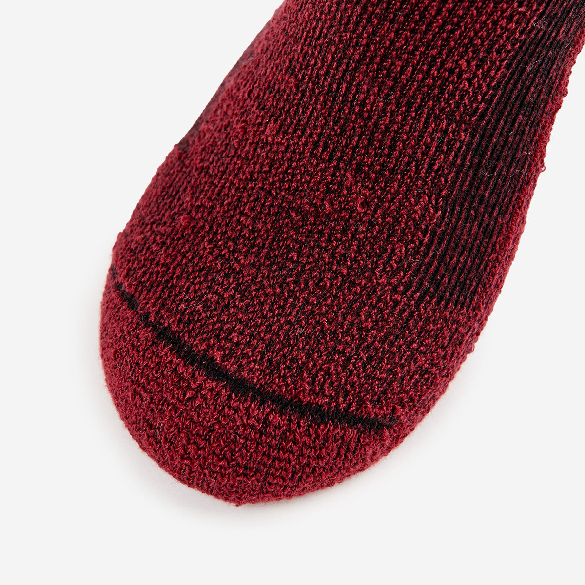 Thorlos hiking low cut sock in burgundy with black toe seam detail on white background