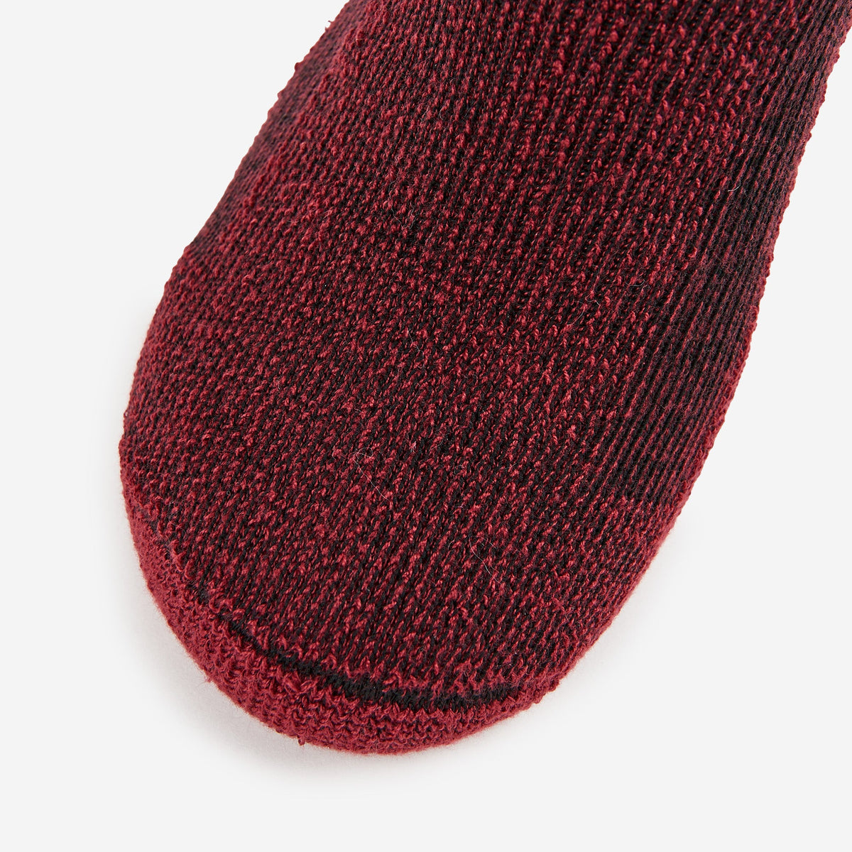 Thorlos women's hiking crew sock toe closeup in burgundy red marl wool blend