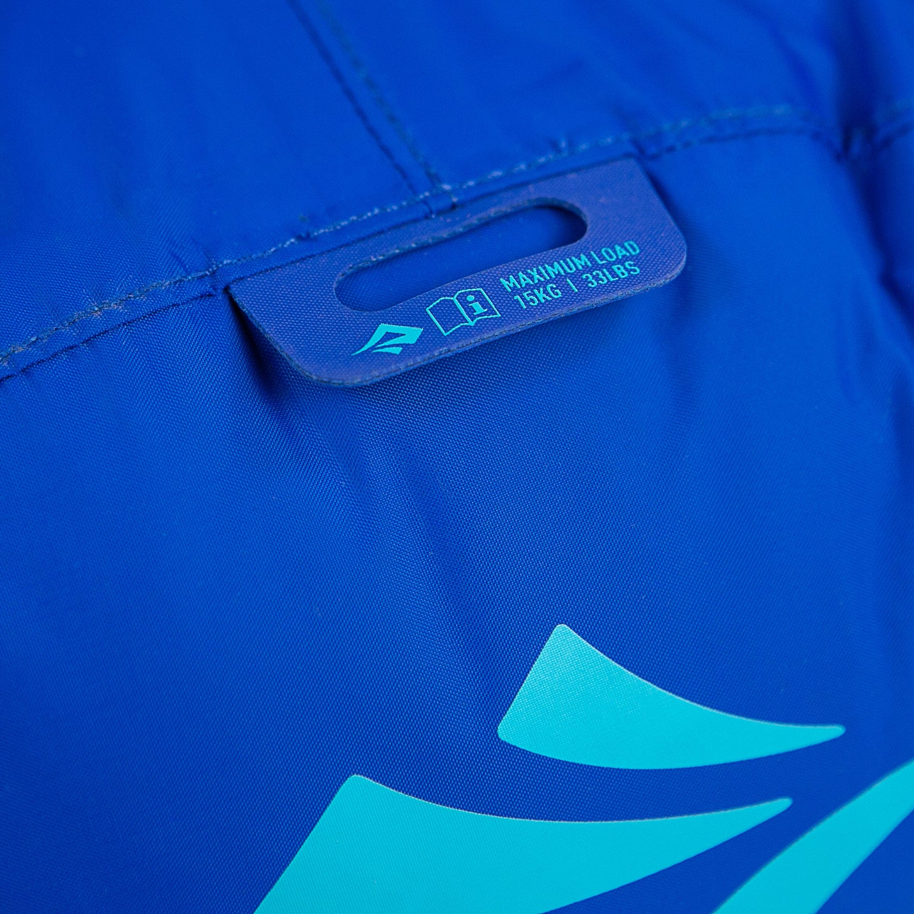 Sea To Summit blue lightweight dry bag showing maximum load label and logo