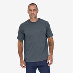 Man wearing Patagonia grey pocket t-shirt with logo on clean white background