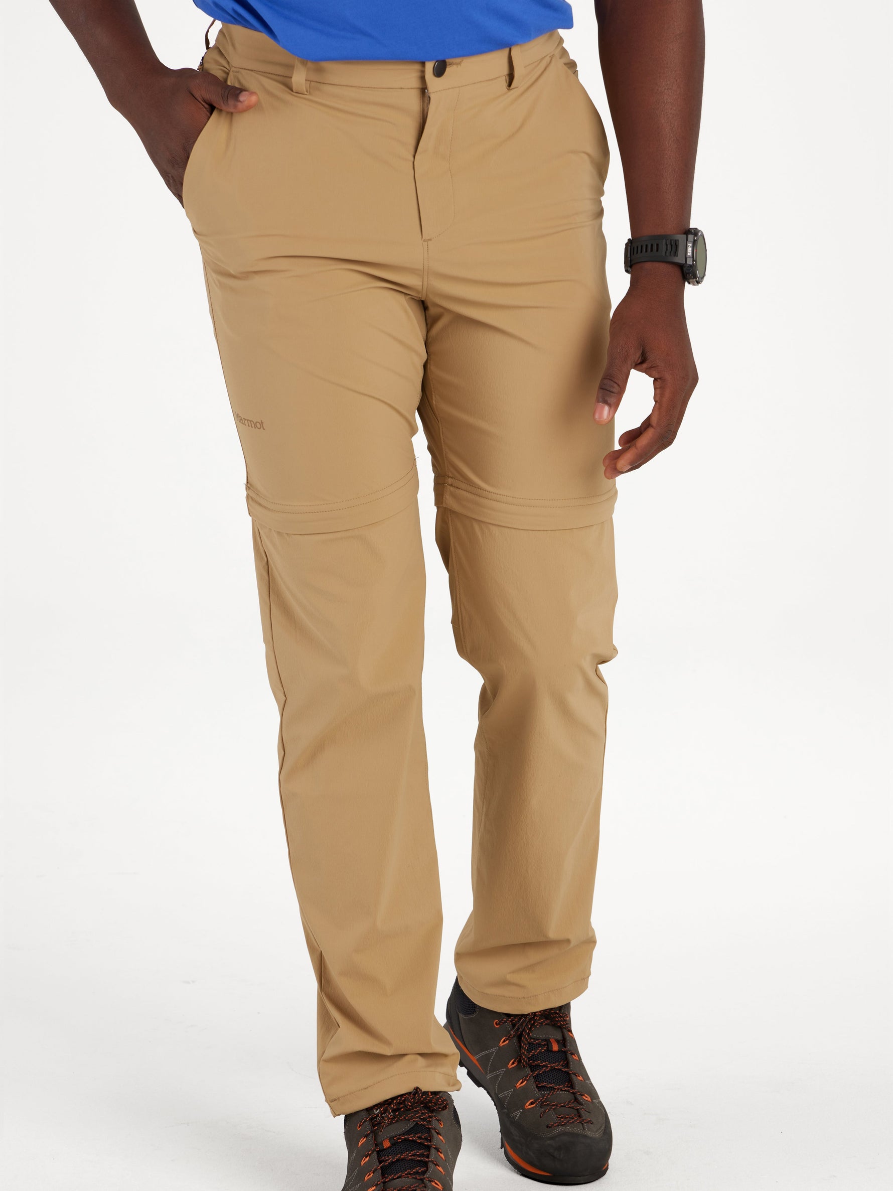 Man wearing tan Marmot Arch Rock convertible pants with hiking boots