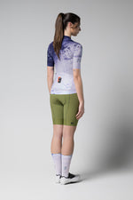 Gobik CX Pro cycling jersey in purple gradient with green shorts, rear view