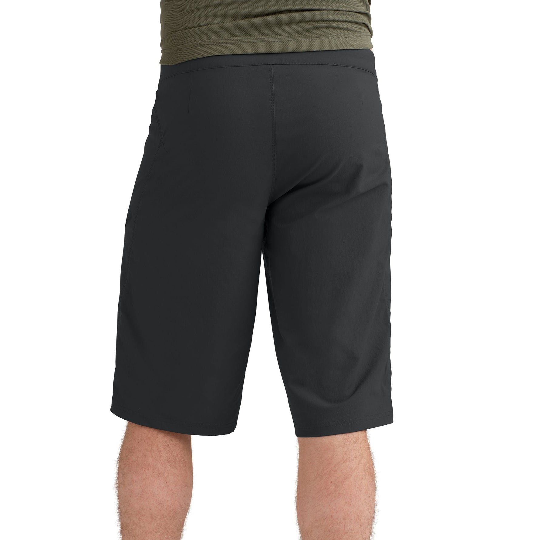 Black athletic shorts on model with olive green shirt, studio photography