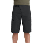 Black Dakine Vectra mountain bike shorts with ventilation holes and zippered pockets