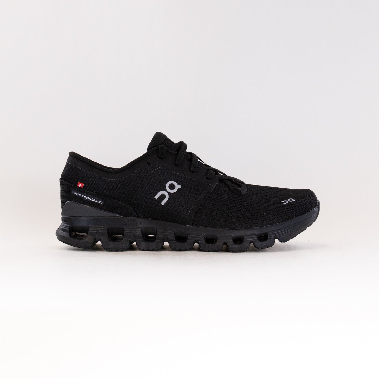 On Cloud X 4 running shoe in black colorway with signature CloudTec sole