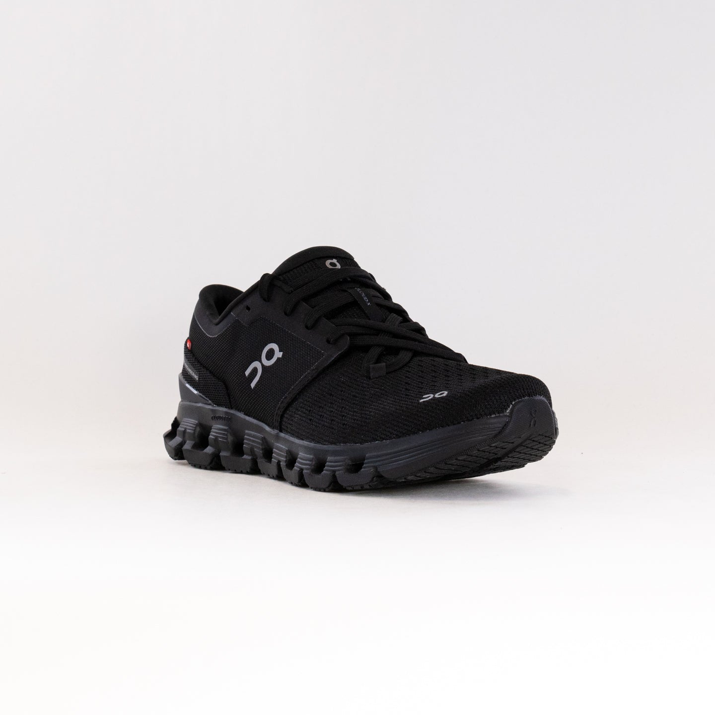 On Cloud X 4 women's running shoe in black and eclipse colorway with signature cloud sole