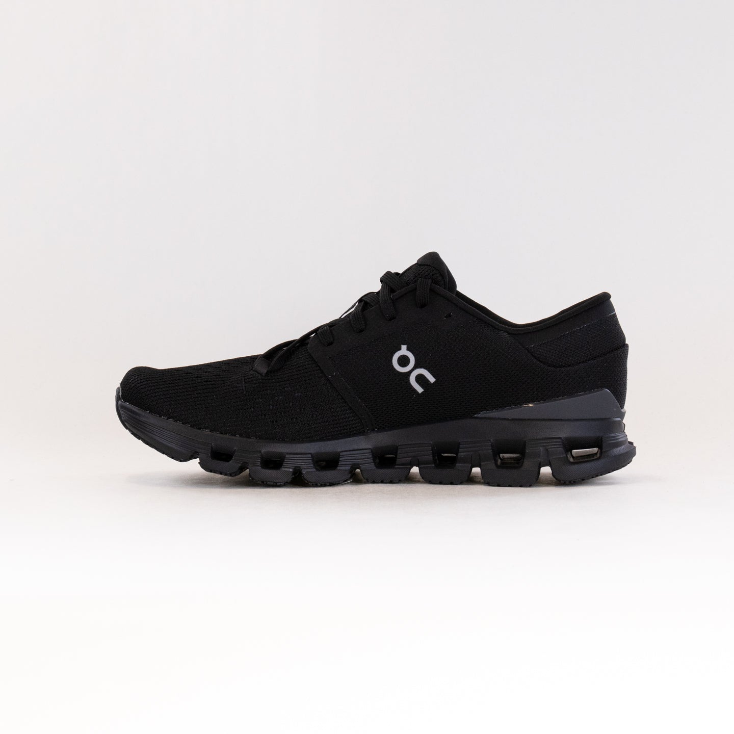 On Cloud X 4 running shoe in black colorway with segmented sole