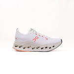 On Cloudsurfer Max women's running shoe in ivory white with orange salmon accents