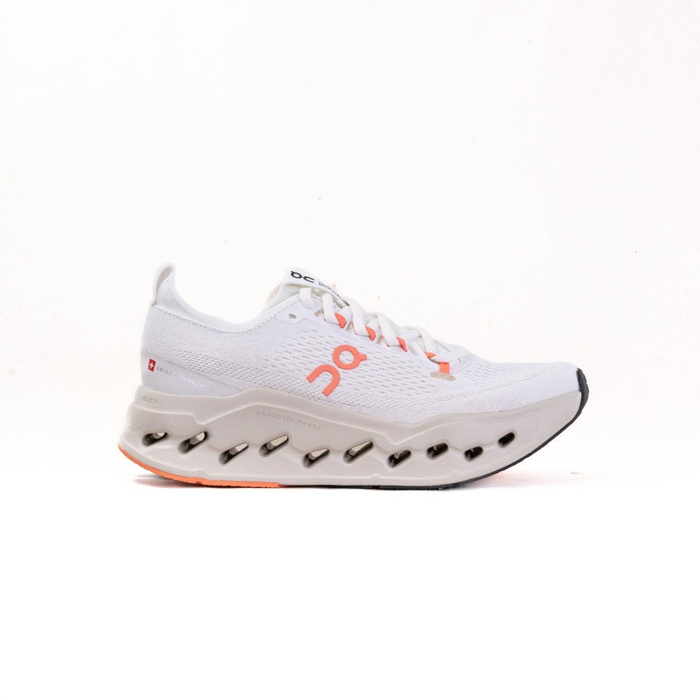 On Cloudsurfer Max women's running shoe in ivory white with orange salmon accents