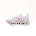 On Cloudsurfer Max women's running shoe in white with coral orange accents
