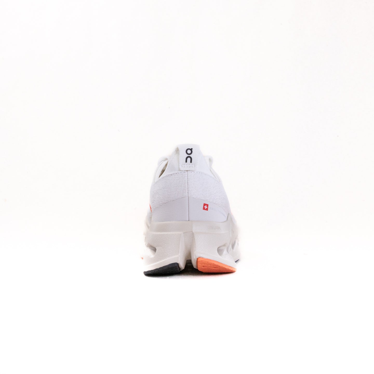 On Cloudsurfer Max women's running shoe in ivory white with salmon orange accent