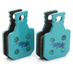 Pair of Magura MT7 Next organic brake pads in turquoise color