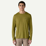 Man wearing olive green Patagonia long-sleeve shirt with small chest logo