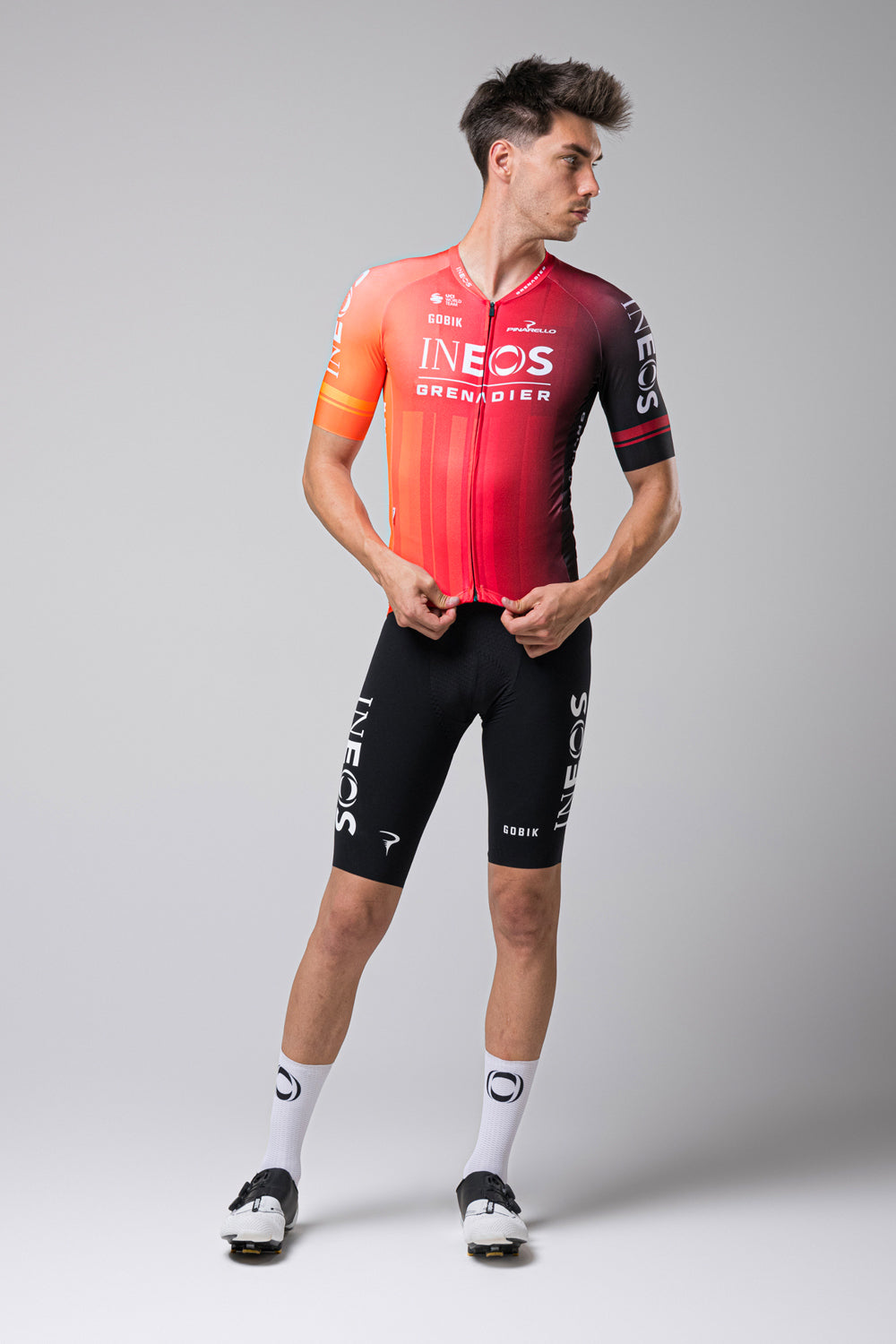 Male model wearing Gobik Odyssey cycling jersey in INEOS Grenadiers red team colors