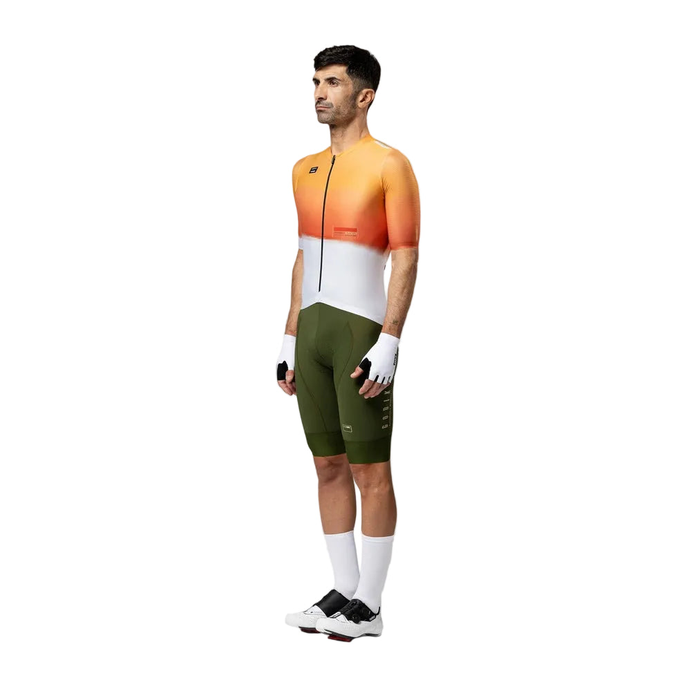 Gobik Attitude2.0 Men's Jersey in orange gradient cycling outfit with green shorts