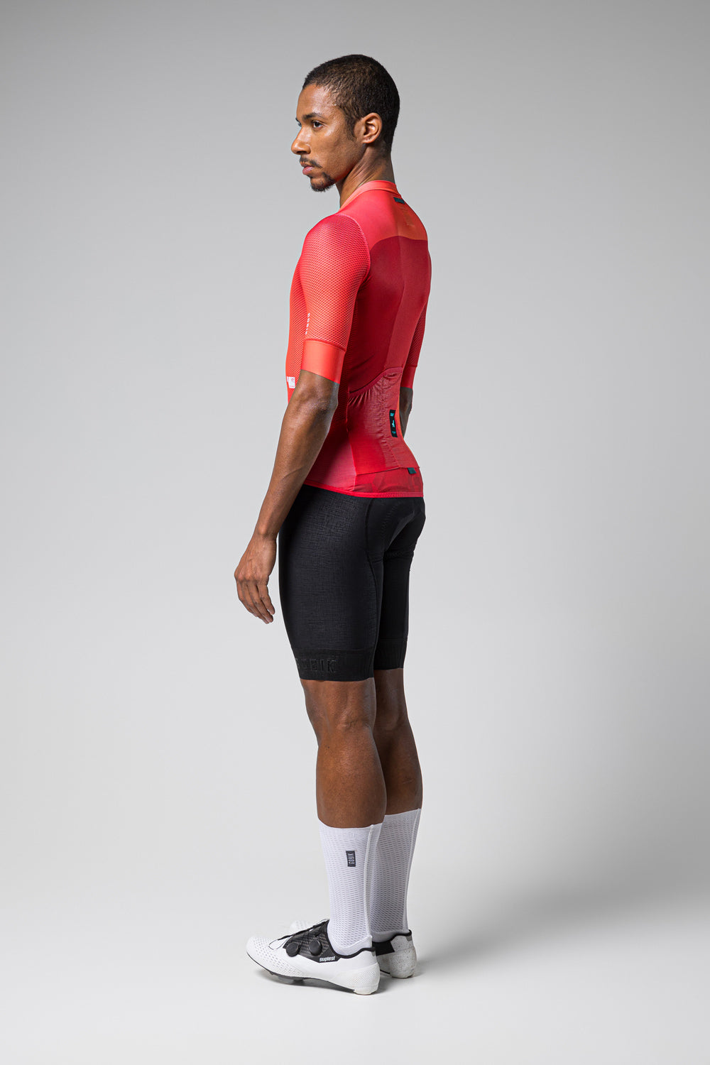 Man wearing Gobik Carrera 2.0 short sleeve cycling jersey in cherry red color