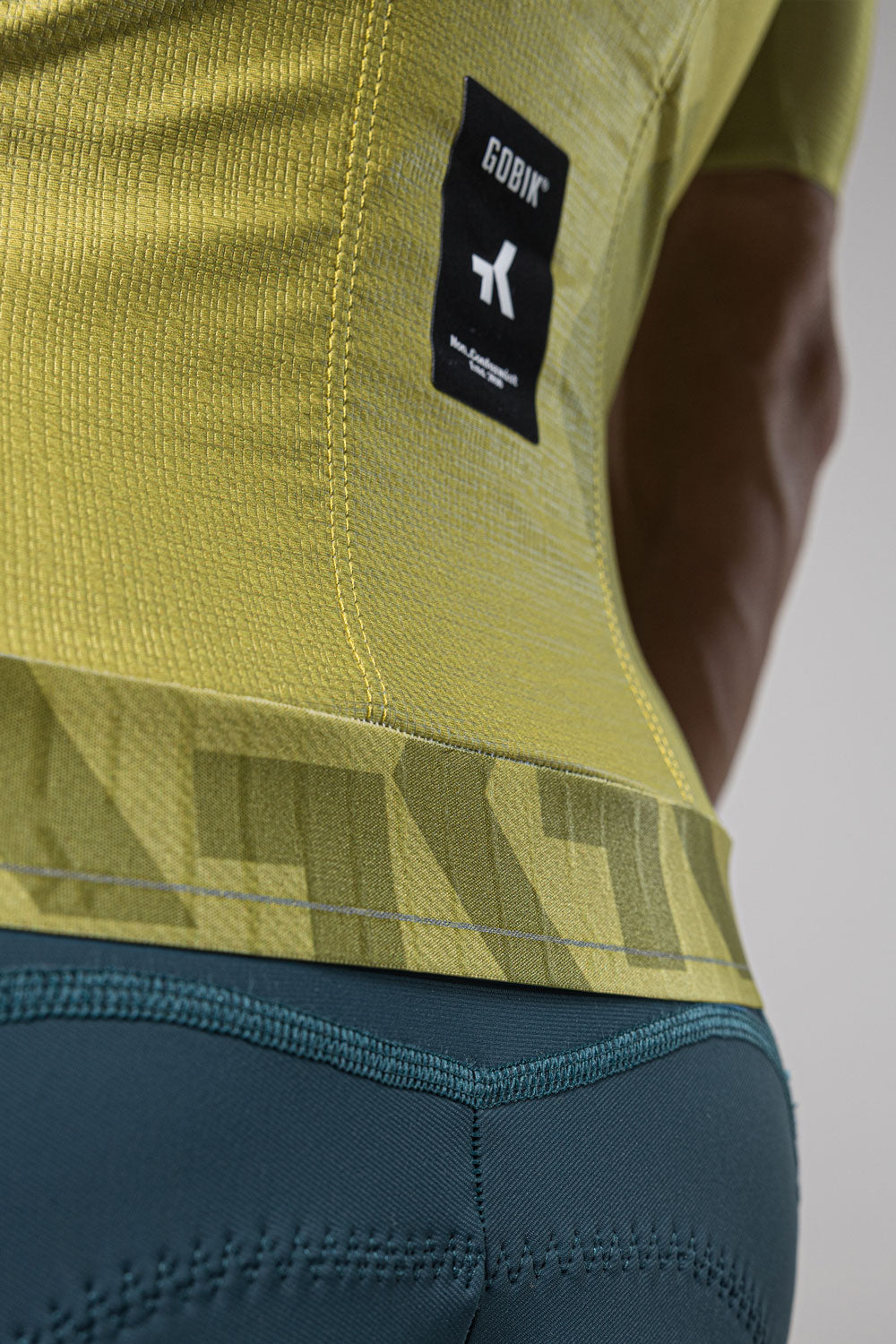 Gobik Magnitude cycling jersey in split green colorway showing technical fabric detail
