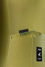 Gobik Magnitude cycling jersey detail showing olive green fabric texture and brand label