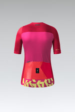 Gobik Stark women's cycling jersey in azalea pink with red sleeves and yellow branding