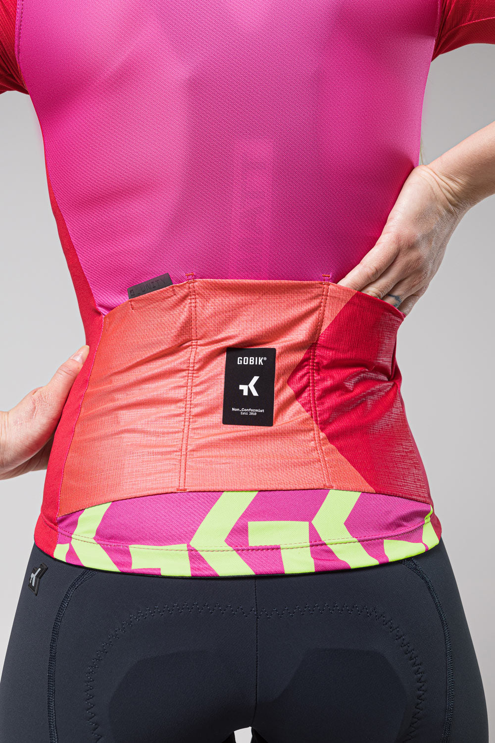 Gobik Stark women's cycling jersey in bright azalea pink with gradient details
