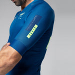 Man wearing blue Gobik CX 2.0 Pro cycling jersey with yellow accents