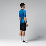 Male model wearing blue Gobik CX 2.0 Pro cycling jersey with black shorts
