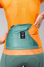 Gobik CX Pro jersey in tangerine orange showing back pocket detail and internal construction