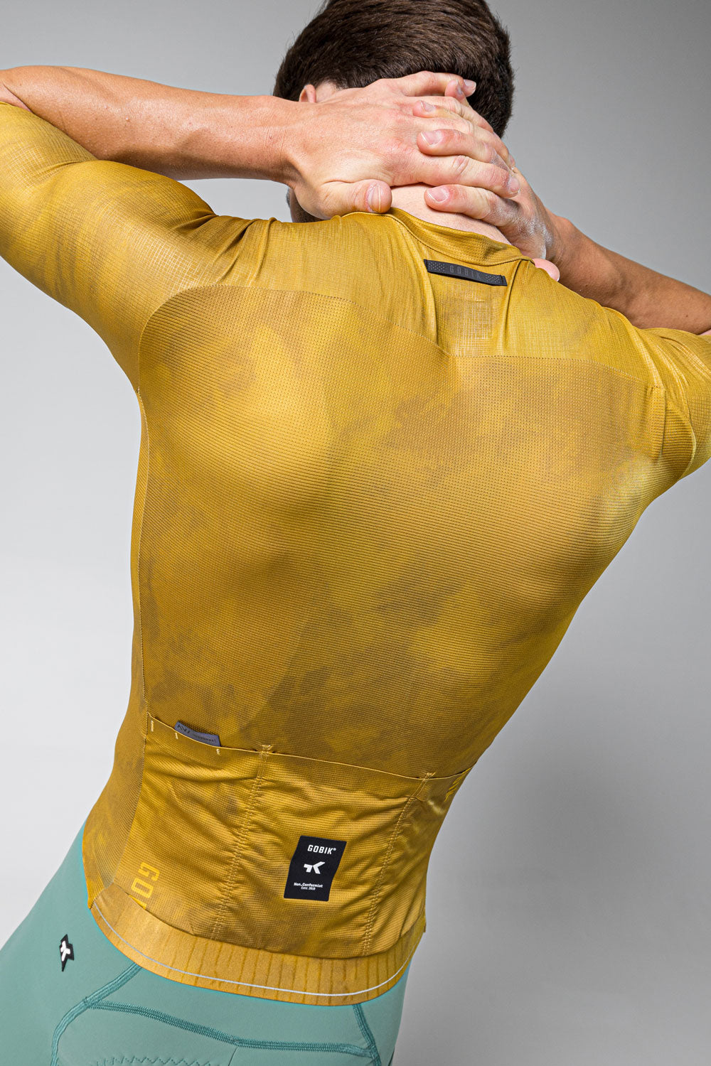Gobik Infinity short sleeve cycling jersey in ginger yellow with back pockets