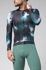Man wearing Gobik CX Pro cycling jersey with cosmic galaxy print pattern