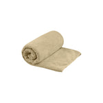 Sea To Summit Tek Towel in desert brown color, rolled and partially unfolded