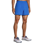 Brooks Sherpa 5-inch running shorts in Amparo Blue worn by male model with white Brooks sneakers
